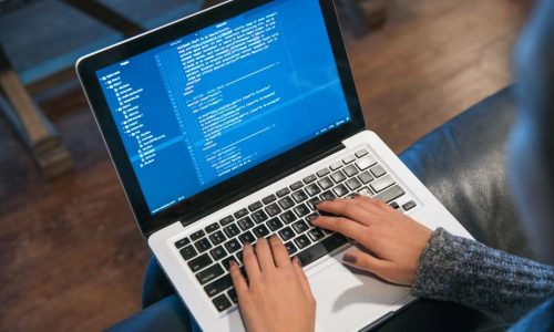 hands-typing-code-on-laptop
